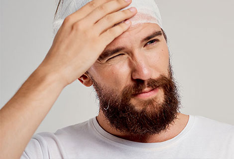 Go to concussion after an auto accident Man suffering with from a concussion following a car accident