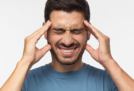 Go to headaches after an auto accident Man suffering with from headaches following a car accident